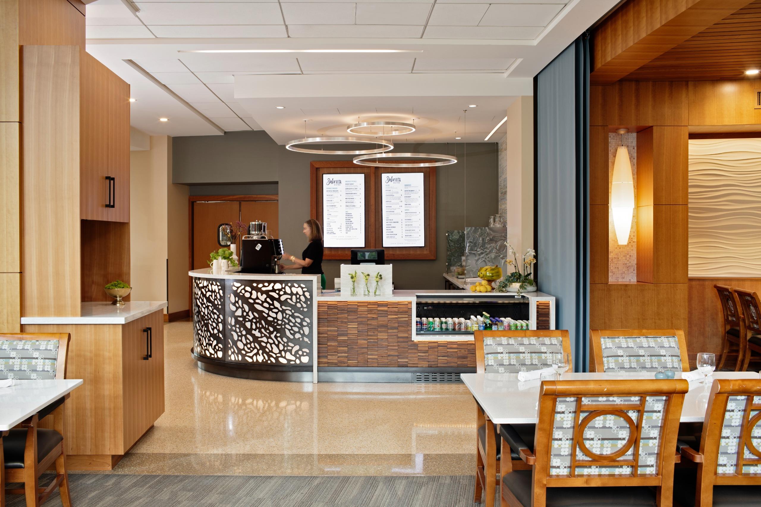 Mirabella Portland - Dolce Vita Bistro. There is an attendant at a grab-and-go counter.